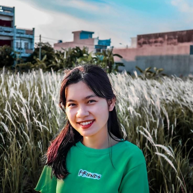 Kaveri Mehta, Lead Design Curator at LakeShoreCraft, reviewing corporate floral arrangements